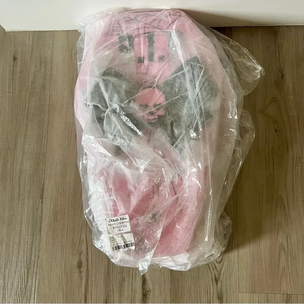 Dolls Kill oversize pink and black skull spiderweb coffin backpack. New in box